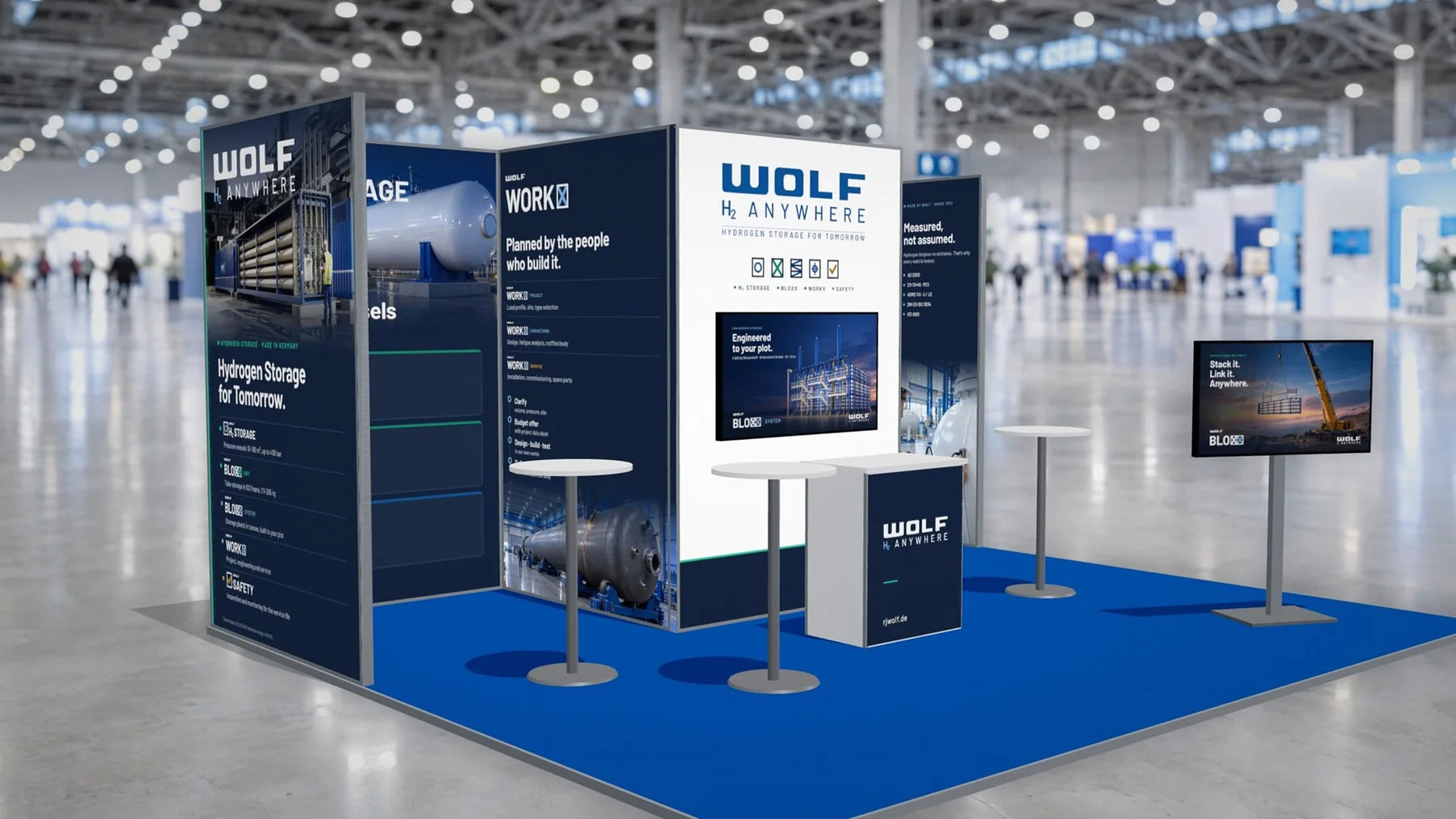3D-Modell des WOLF Messestands mit Standgrafik für H₂ STORAGE, WORKX und BLOXX